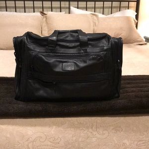 TUMI black leather luggage/duffel